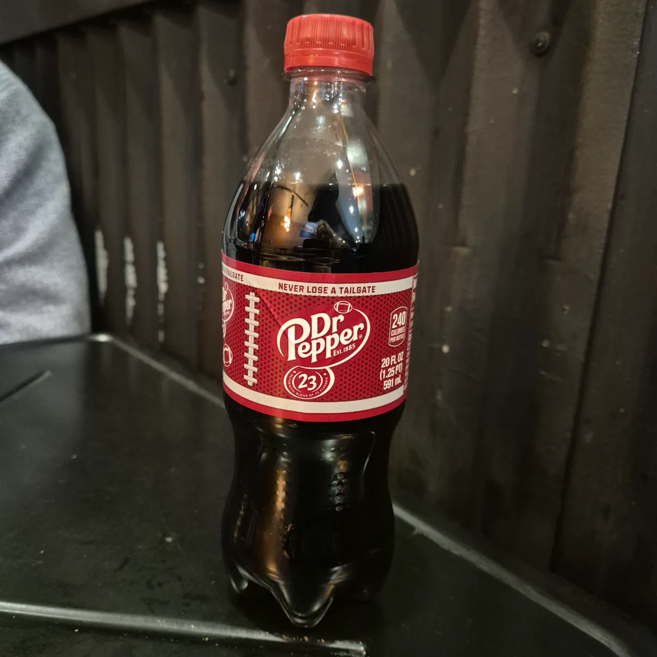 A bottle of Dr Pepper soda.